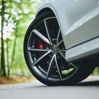 white audi with grey wheels