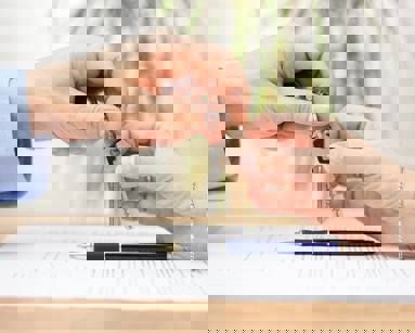 close up of hands holding keys