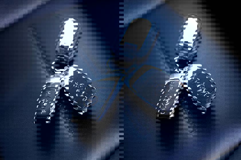 Black Mercedes car keys on a seat