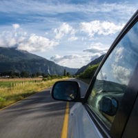 close up of car driving on country road