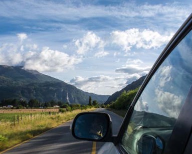 close up of car driving on country road