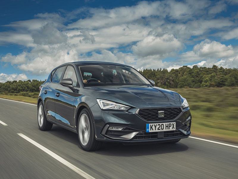 black seat leon driving on the road