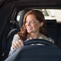woman driving a hybrid car