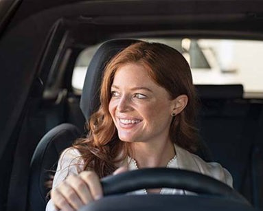 woman driving a hybrid car
