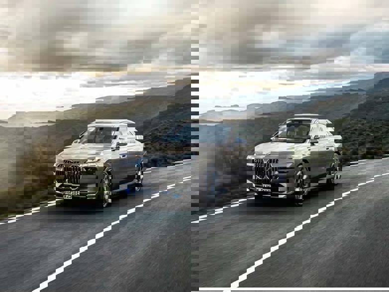 grey bmw 7 series driving on road