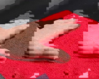 close up of hand on polishing cloth