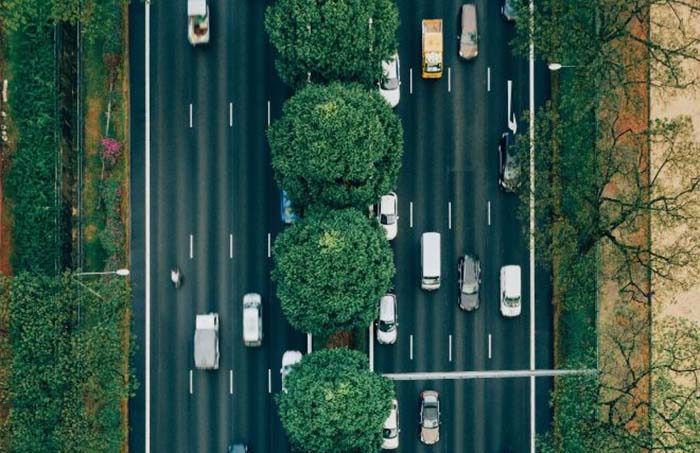 overhead shot of cars driving on road