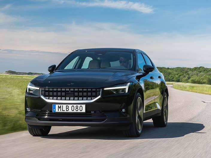 black polestar 2 driving on road