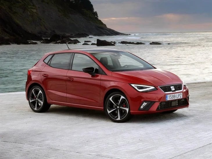 red seat ibiza next to the sea