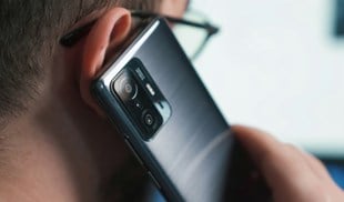 a close-up of a person talking on a cell phone