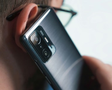 a close-up of a person talking on a cell phone