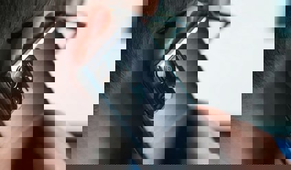 a close-up of a person talking on a cell phone