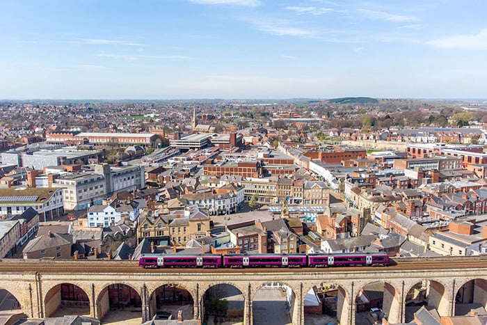 photo of train passing city