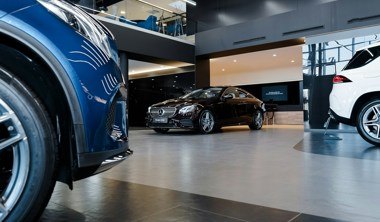 Black Mercedes-Benz car in a showroom