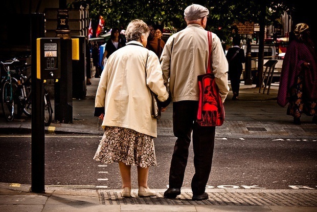 Old people waiting to cross the road