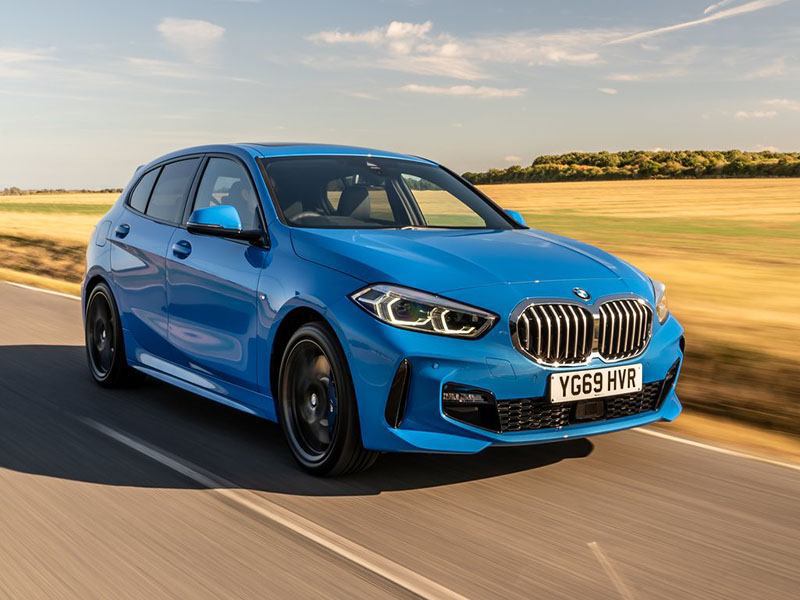 blue bmw 1 series driving on road