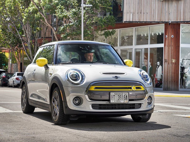 Mini Electric Hatchback driving on road