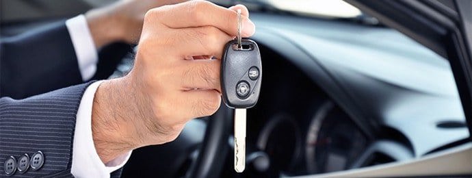 man holding car keys