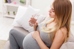 Pregnant woman drinking water