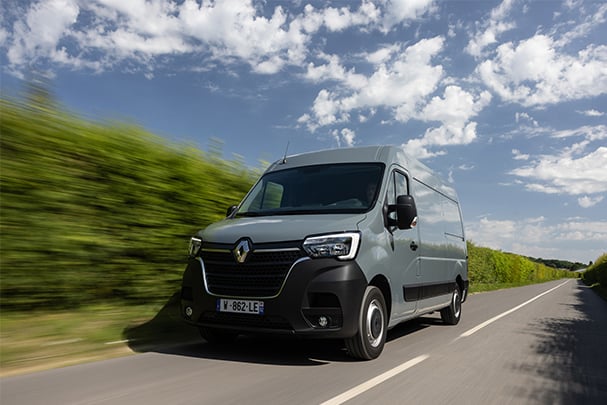 Renault Master in grey driving on the road