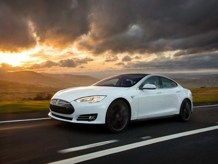 Tesla Model S on a stormy country road