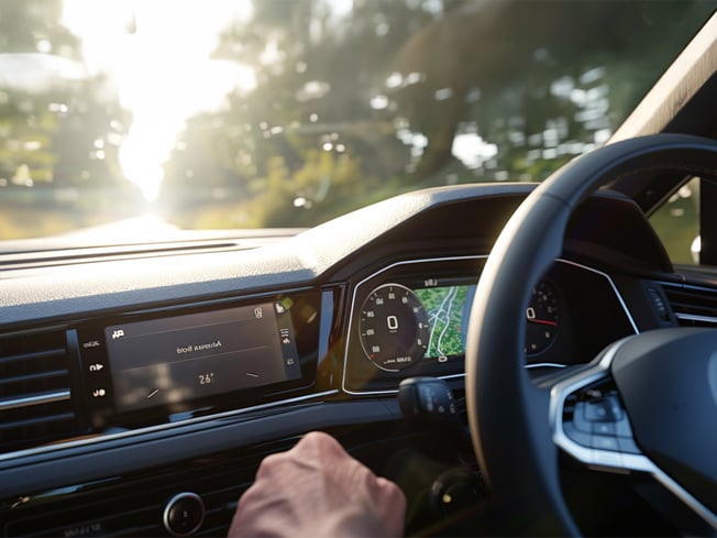 Driver’s view of a Volkswagen dashboard with digital displays and Air Conditioning System