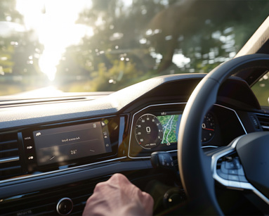 Driver’s view of a Volkswagen dashboard with digital displays and Air Conditioning System