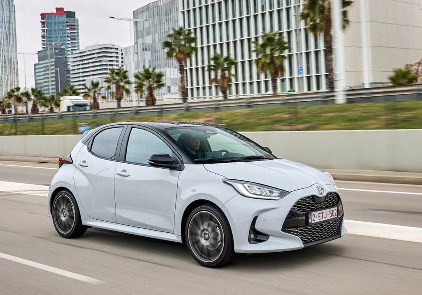 Toyota Yaris lease car in grey driving on the road