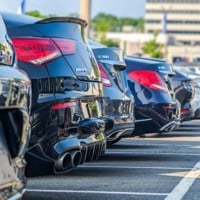 a row of parked cars in a parking lot