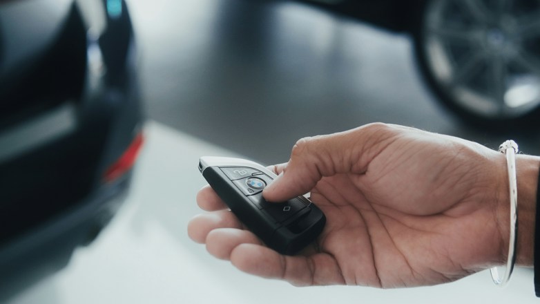 person holding a key in hand