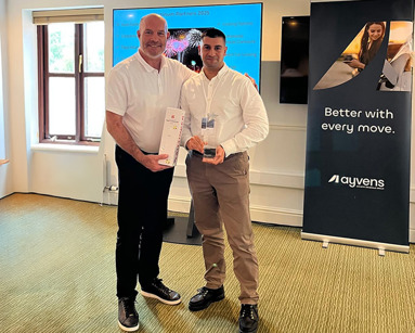 Charles Campbell collecting Platinum-Premier Broker awar