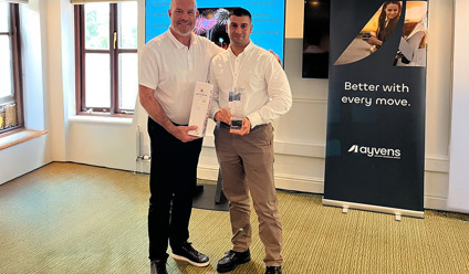 Charles Campbell collecting Platinum-Premier Broker awar