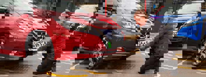 dealer putting registration plate onto car