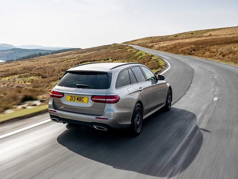 silver mercedes-benz e-class estate driving on the road
