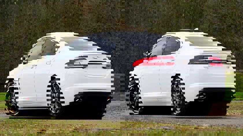 White Jaguar saloon car rear end