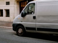 van parked in front of building