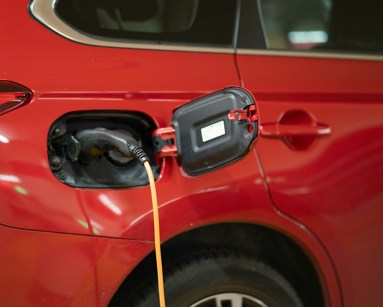 red electric car charging