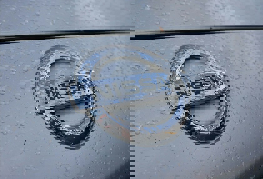 Silver Nissan logo on car
