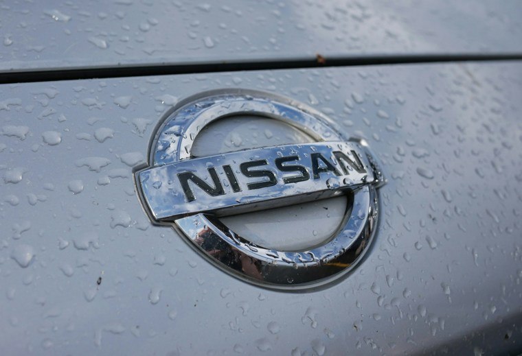 Silver Nissan logo on car