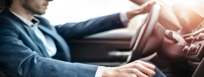 Businessman in car driving