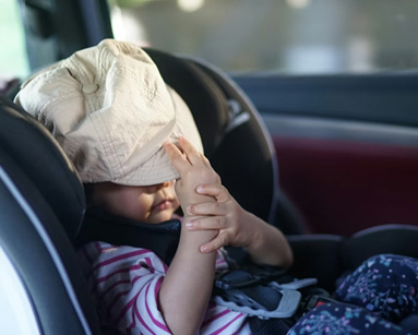 child sitting in a car seat