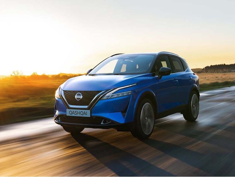 Nissan Qashqai driving on road