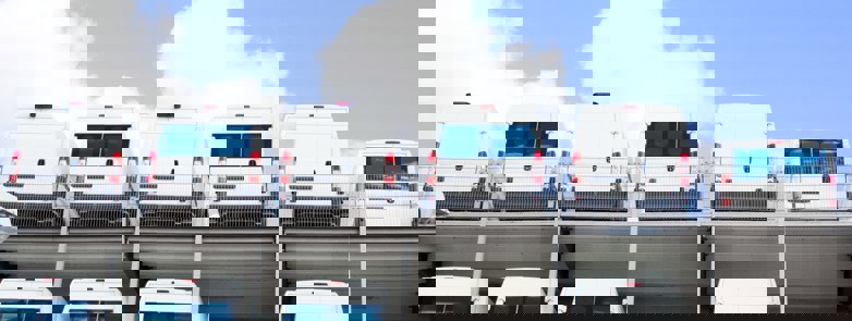 white vans parked in a row