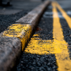 single yellow link on kerb